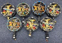 SEVEN DISNEY ANIMATED TALKING WALL CLOCKS, Mickey Mouse and Pooh Bear, each 30cms (diam.)