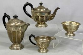 SILVER FOUR-PIECE TEA SERVICE of panelled circular form, ebonised handles and finials, Emile Viner