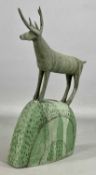 ‡ ANNA NOEL studio pottery sculpture of a deer standing on a mound, green mottled glaze, 34.5cms (h)