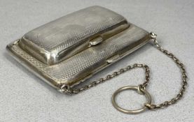 GEORGE V SILVER PURSE, leather lined interior with note pad and pencil, engine turned decoration,
