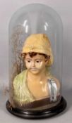 PAINTED CHALK WARE / PLASTER BUST OF YOUNG BOY, on ebonised stand under glass dome, 40cms (h)