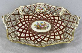 DRESDEN TWO-HANDLED DISH, reticulated sides having panels with hand-painted floral sprays, gilded