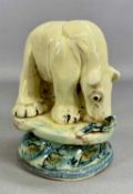 ‡ WILLIE CARTER (British, b. 1952) glazed terracotta sculpture of a polar bear eating a fish, on