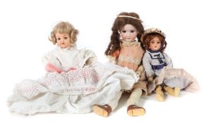 3 Puppen um 1920,