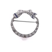 Estate Platinum Bow Design Diamond and Synthetic Sapphire Circle Pin