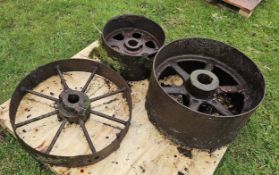 Three cast iron stationary engine pulleys