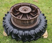 Two cast iron tractor wheels