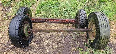A pair of axles with wheels