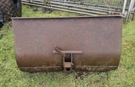 A Ferguson front loader bucket, rust holes