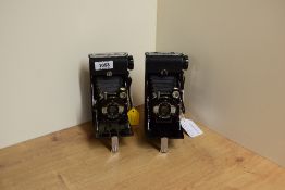 Two Kershaw Eight - 20 Penguin folding cameras