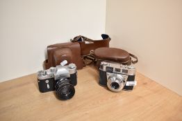 Two cameras. A Zenit with a Helios-44 lens and a Kodak Retinette with a Rodenstock Reomar 1:2,8 45mm