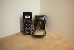 A Rolleiflex reflex camera No1067099 in leather cover
