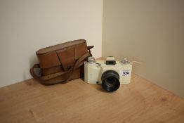 An Ilford Advocate in ivory enameled finish having Dalmeyer Anastigmat 1:4,5 35mm lens