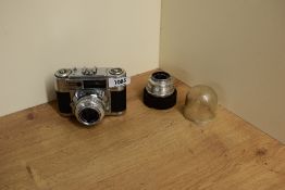 A Braun Paxette camera with Braun Katagon 1:2,8 50mm lens and a Staeble-teleson 1:5,6 85mm lens