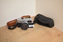 An Olympus 35RS camera with Olympus E Zuiko 1:2,8 42mm lens