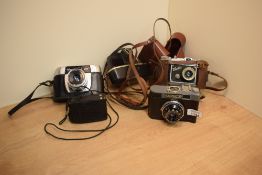 Three cameras. A Saraber Finetta Super, a Halina Paulette and a Cosmic 35 all A/F and a Leningrad