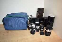 A Nikon F2 camera with Nikkor-N Auto 1:2,8 24mm lens, a Nikkor-H Auto 1:4,5 300mm lens, a Nikkor -