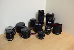 A selection of Olympus OM-System Zuiko lenses - 24mm f3.5, 28mm f3.5, two 35mm f2.8, 50mm f1.4, 65-