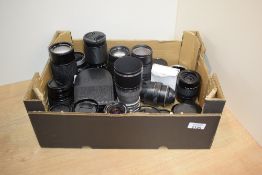 A box of various lenses and converters. A Jupiter -9 2/85, an Auto Chinon MC 1:2,8135mm, a Bell &
