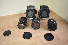 A Case containing Two Mamiya 645 camera bodies, with a Mamiya Sekor 1:1,9 80mm lens, a Mamiya
