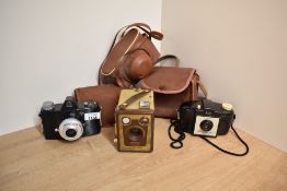Three cameras. An Agfa Click 1, a Kodak Brownie 127, and a Kodak Brownie Six-20 Model F box camera