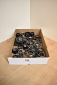 A tray of twenty three black painted and shuttered lenses