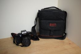 A Canon EOS 700QD camera with Canon Zoom lens Ef35-80mm 1:4-5,6
