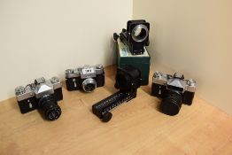 Three Zenit cameras. A Zenit - B camera with Industar 50-2 1:3,5 50mm lens and a Zenit 3M with