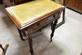 A 19th Century hall table in the Regency style having frieze drawer and skiver leather top,