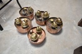 Five vintage copper and brass poultry heaters