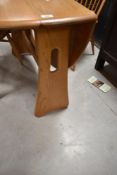 An Ercol Windsor drop leaf dining table