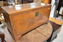 A traditional oriental camphor wood blanket box, dimensions approx. 94 x 46 x 50cm