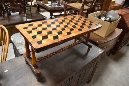 A 19th Century parquetry coffee table having turned frame, approx. 87 x 41cm