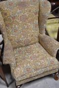 A vintage Parker Knoll wingback armchair