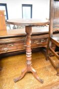 A 19th Century mahogany pedestal occasional table having circular top , turned column and trefoil