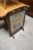 A traditional embroidered firescreen
