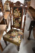 A 19th Century mahogany framed hall chair , having woolwork seat and back panel