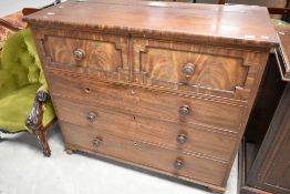 A 19th Century mule chest having lift lid with two faux drawers over three long drawers,