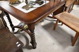 An early 20th Century oak dining table having H stretcher and twist legs supports, approx. 133 x