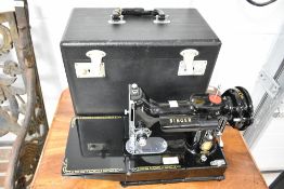 A vintage Singer 222K sewing machine, case and accesories