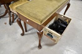 An early 20th century duet piano stool