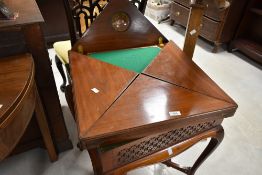 A 19th Century mahogany envelope card table, having blind fret frieze and drawer , on shaped legs