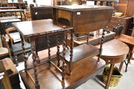 Two early 20th Century oak tables having twist legs