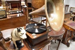 A vintage windup gramophone, unbranded but very clean running internal mechanism, with copper horn