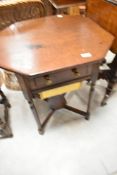 A 19th Century mahogany sewing table having octagonal top, width 56cm