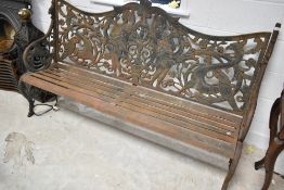 A vintage cast iron garden bench , having figural and mythical decoration, length approx. 183cm