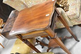 A Victorian mahogany occasional table/plant stand having shaped top and undertier