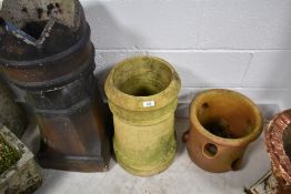 Two traditional chimney pots and a strawberry planter