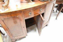A 19th Century Regency design kneehole desk or dressing table having bow front, width approx. 117cm