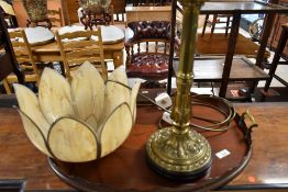 An electric table lamp, in the brass oil lamp style, with additional tulip shade and Edwardian
